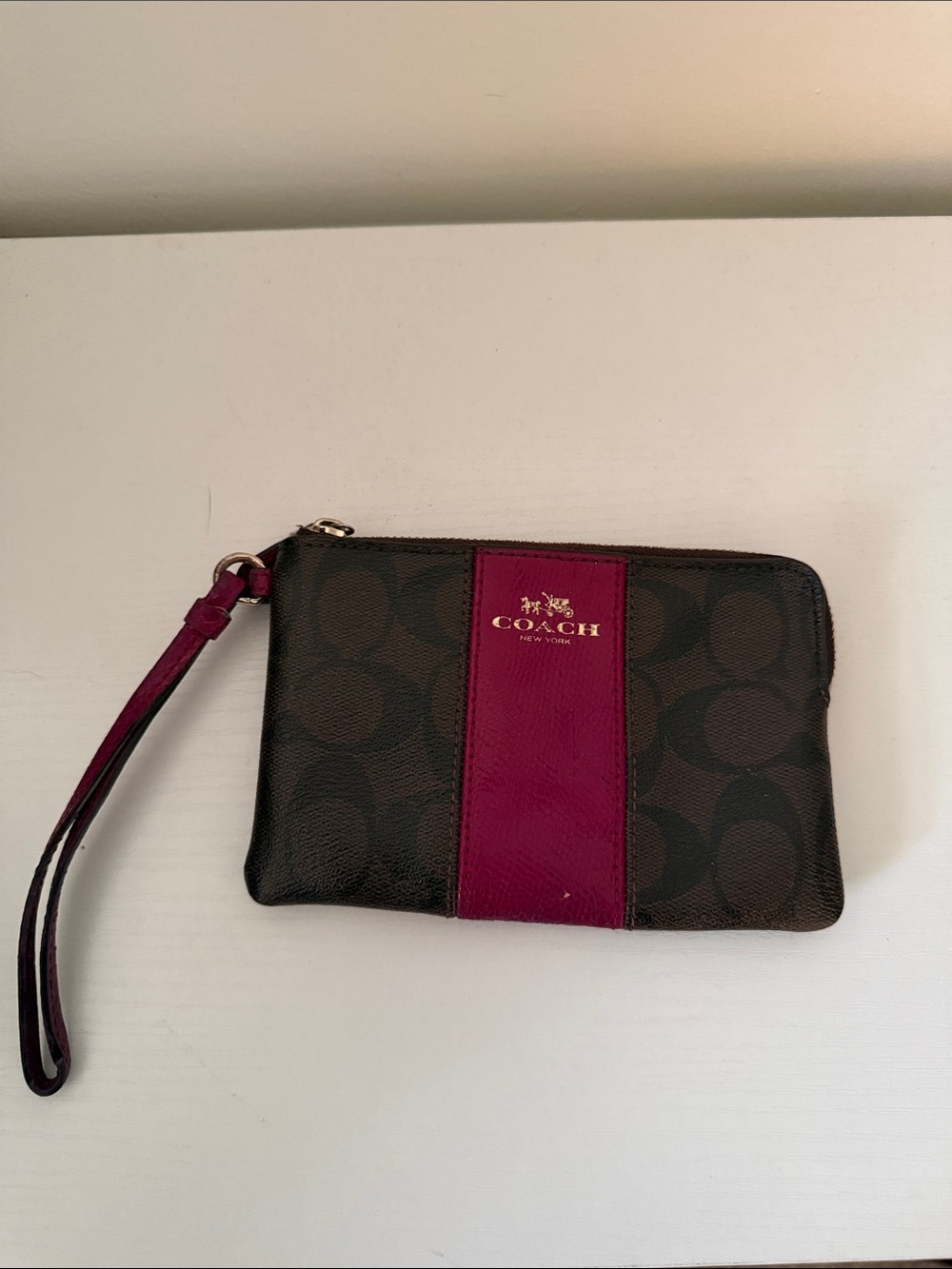 COACH Brown Signature Canvas Wristlet with Berry Stripe
